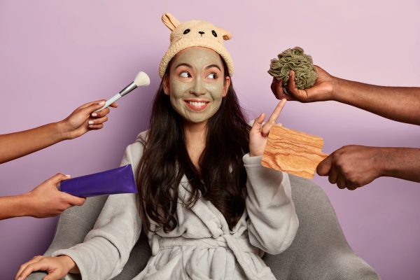 young-millennial-girl-applies-organic-facial-mask-face-after-taking-shower